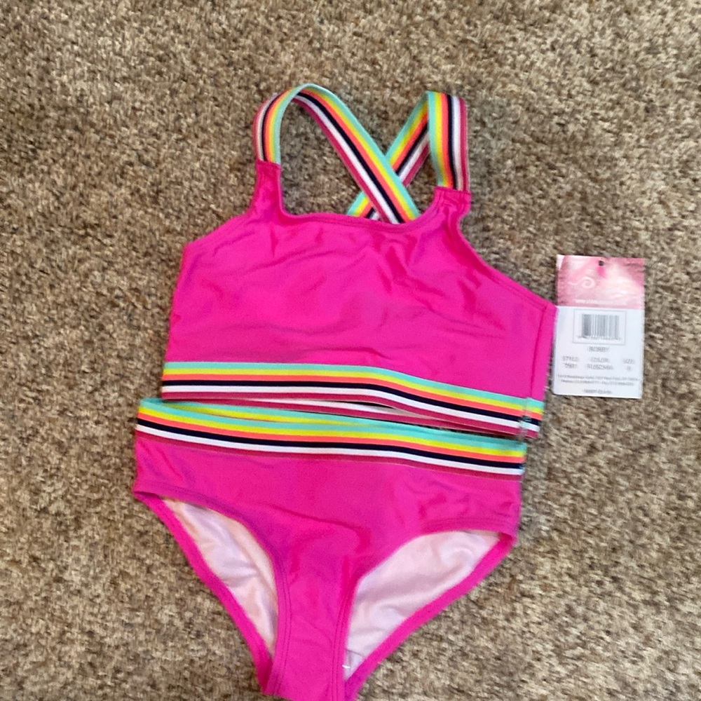 New with tags girls hot pink bikini with design on hem. Size 8.